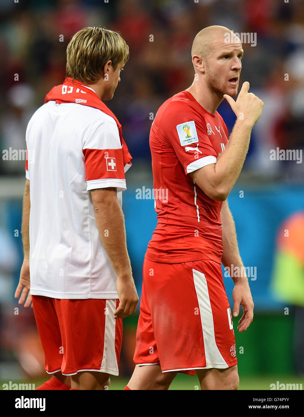 Soccer - FIFA World Cup 2014 - Group E - Switzerland v France - Arena Fonte Nova. Switzerland's Philippe Senderos (right) and Switzerland's Reto Ziegler look dejected after the game Stock Photo