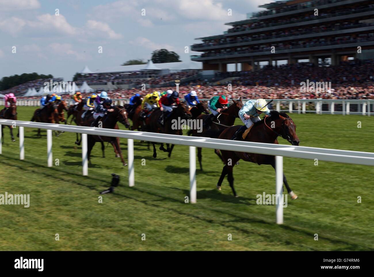 Arab Spring ridden by Ryan Moore on their way to victory in Duke of Edinburgh Stakes during Day Five of the 2014 Royal Ascot Meeting at Ascot Racecourse, Berkshire. Stock Photo