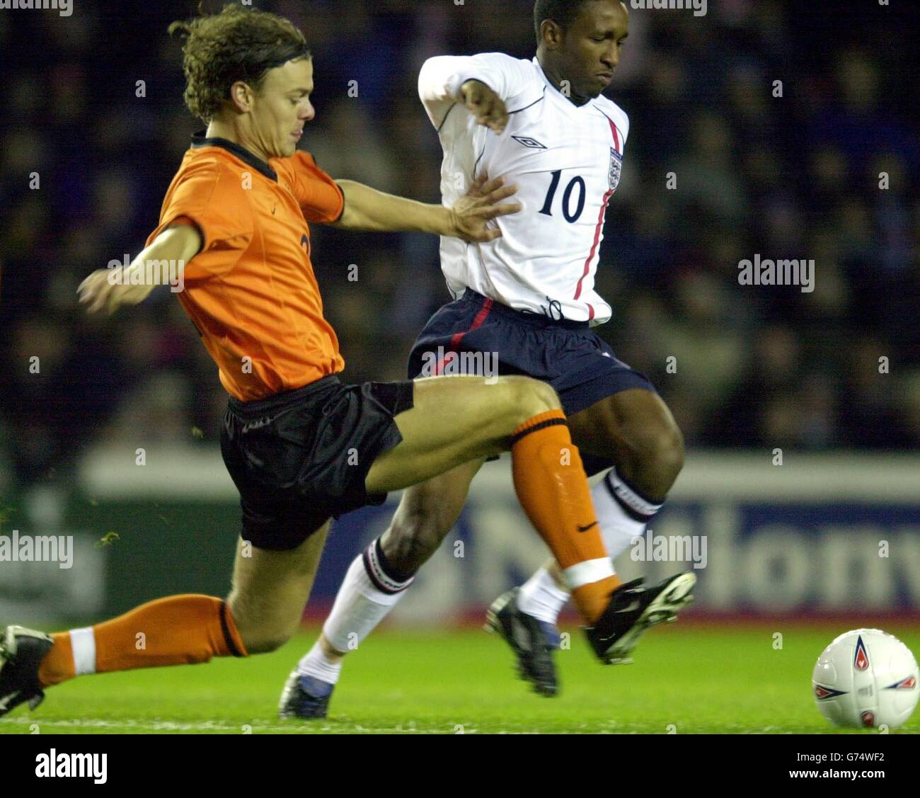 England's Jermain Defoe (right) in action against Holland's Jos Van Nieuwstadt during the European Under-21 Championship Second Leg Play-off game between England and Holland at Pride Park, Derby. Stock Photo