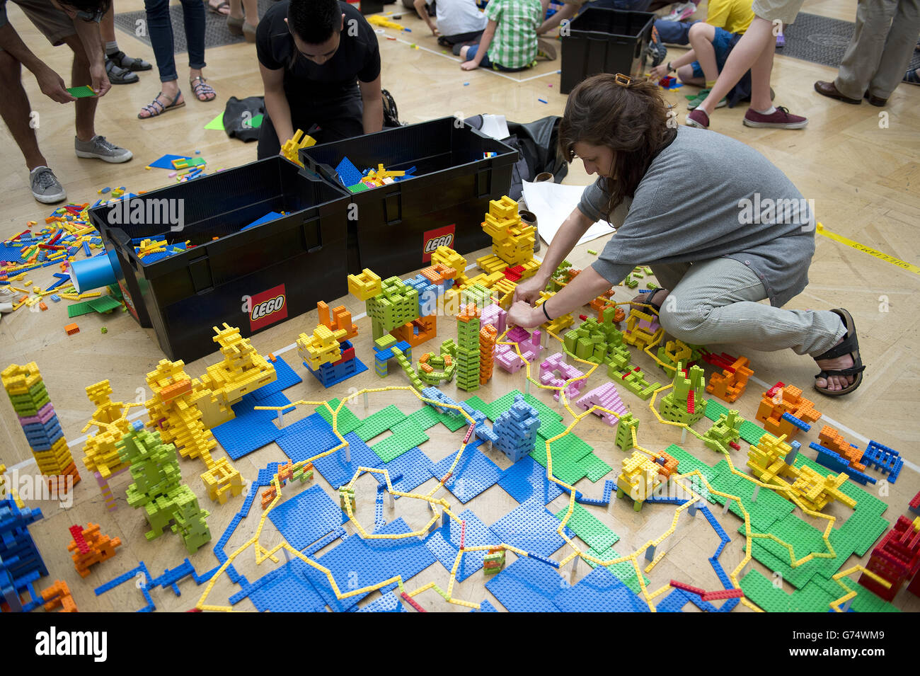 A member of the Stanton Williams team works on their design in the UK's  first Lego battle inside the Royal Academy's Summer Exhibition, Central  London. The event is part of the London