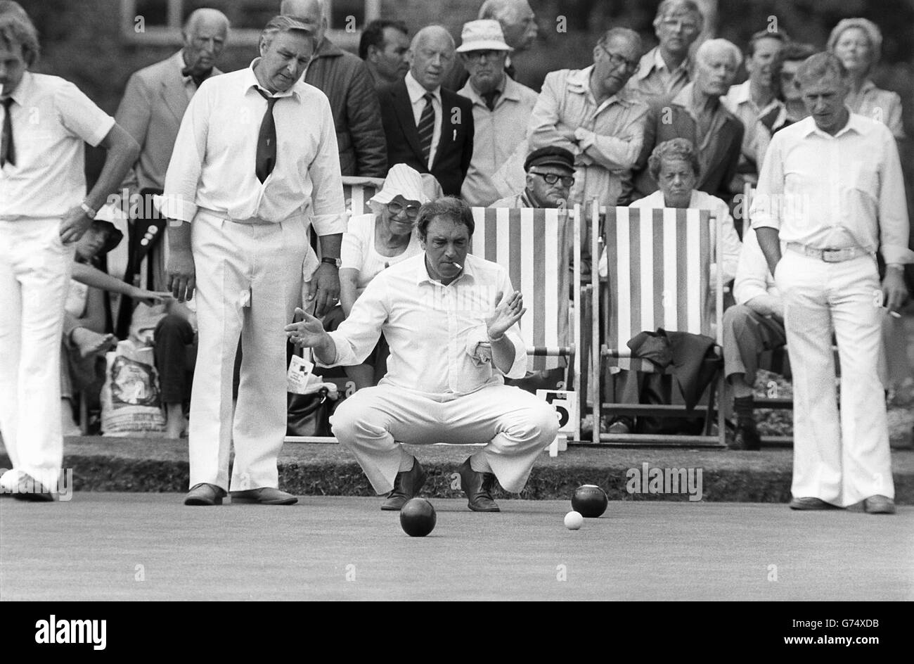 Hampshire B players shows his teammates where to aim on the green during the English Bowls Association National Championships. Stock Photo