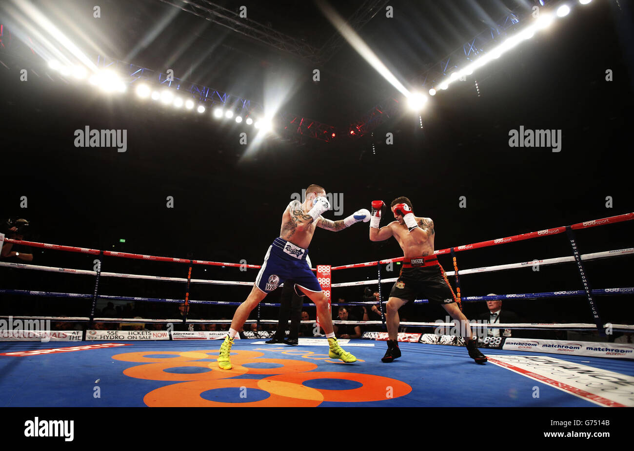 Ricky Burns (left) and Dejan Zlaticanin during the vacant WBC International lightweight title at the Braehead Arena, Glasgow. Stock Photo
