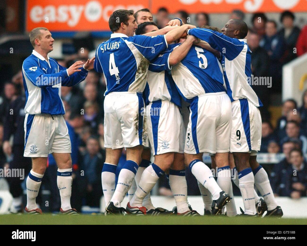 Everton's David Weir (number 5) is smothered by teammates after equalising against Spurs during their Premiership clash at White Hart Lane, London, today, Saturday 19 January 2002. It ended a 1-1 draw. Stock Photo