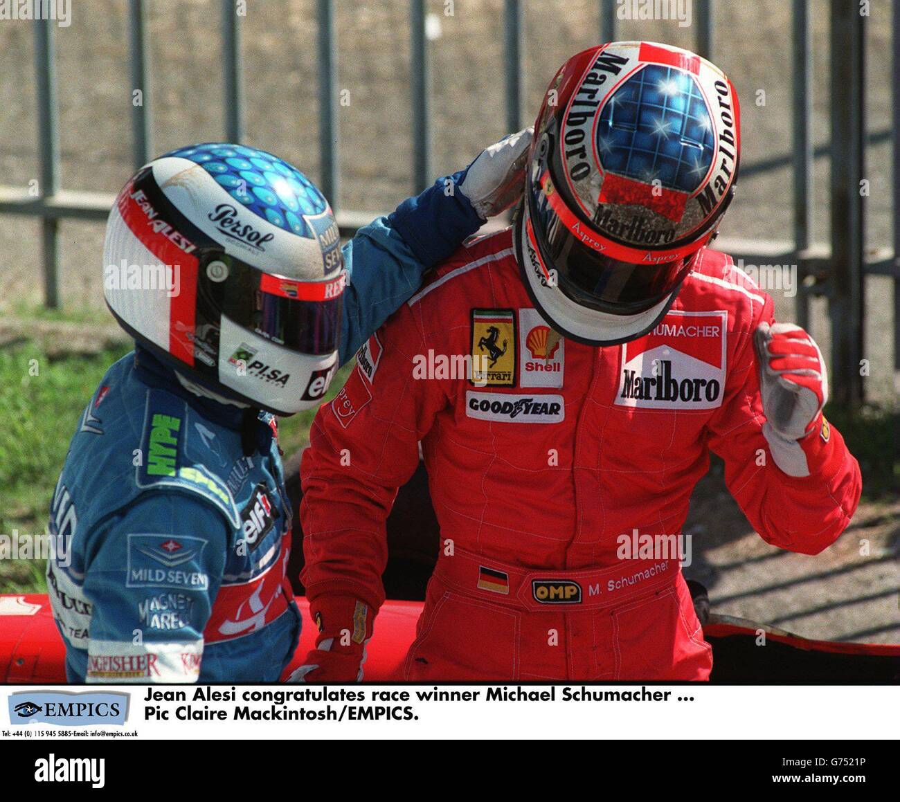Motor Racing ... Italian Grand Prix. Jean Alesi congratulates race winner  Michael Schumacher Stock Photo - Alamy