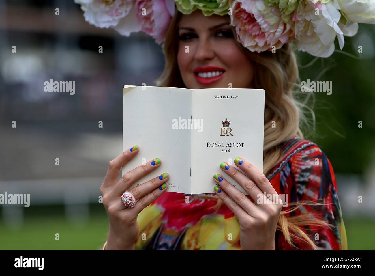 Racegoer Natalia Kapchuk with nails painted in support of Brazil's FIFA World Cup campaign during Day Two of the 2014 Royal Ascot Meeting at Ascot Racecourse, Berkshire. Stock Photo