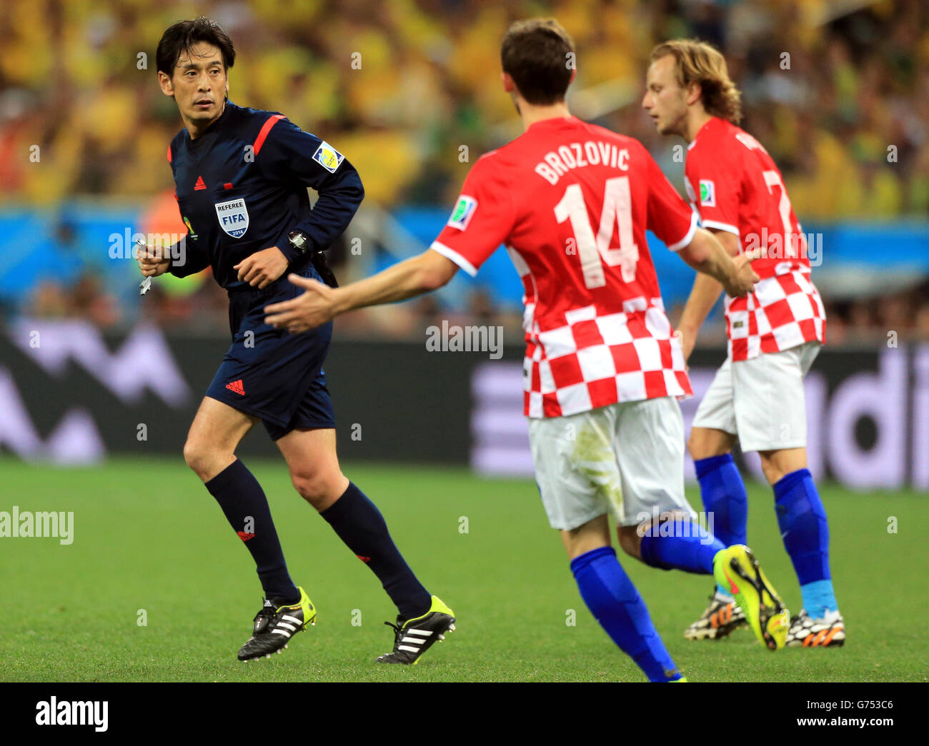 Croatia's Marcelo Brozovic (centre) and Croatia's Ivan Rakitic (right) appeal to referee Yuichi Nishimura Stock Photo