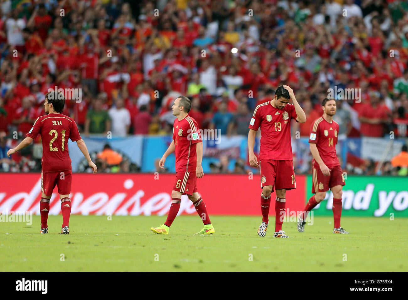 Spain's David Silva, Andres Iniesta, Diego Costa and Xabi Alonso (left to right) stand dejected after conceding their second goal Stock Photo