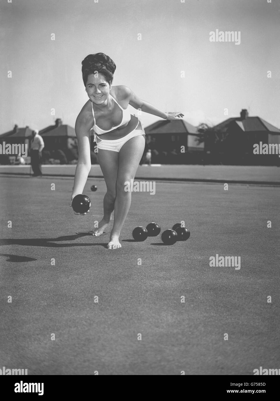 Vivienne Kendrick, 21, of Lytham St Annes, Lancashire, is not only a bathing beauty contest winner, but is also an accomplished green bowler having won her local bowling club president's handicap. Here she is practising for future bowling handicaps. Stock Photo