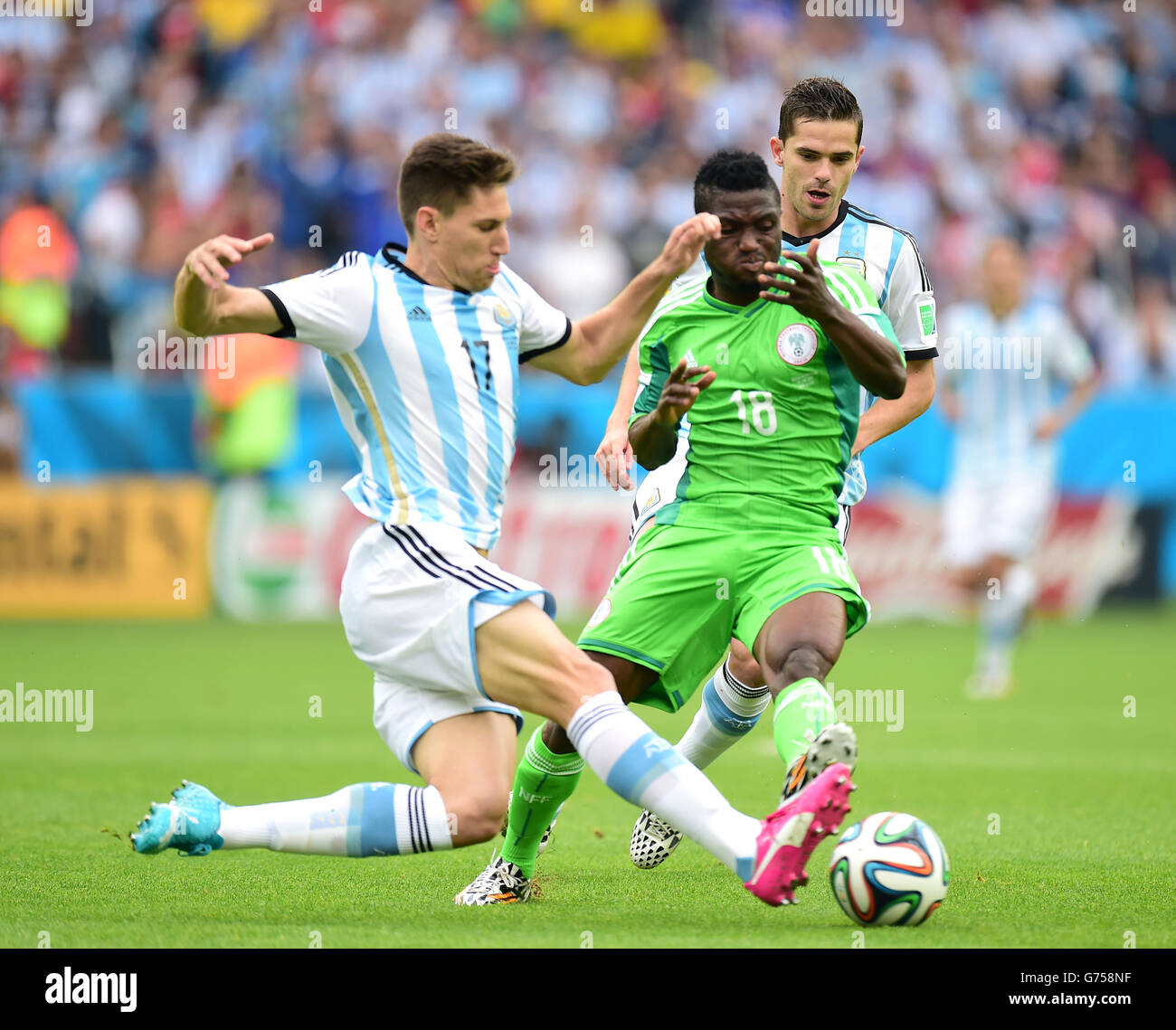Nigeria's Michael Babatunde (right) and Argentina's Federico Fernandez battle for the ball Stock Photo