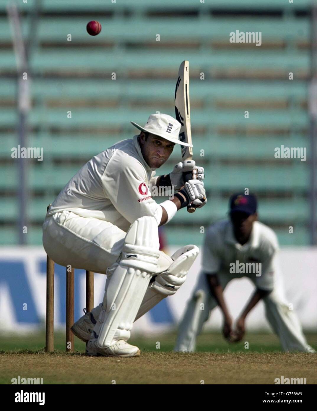 England batsman Mark Butcher ducks low under a bouncer on the second