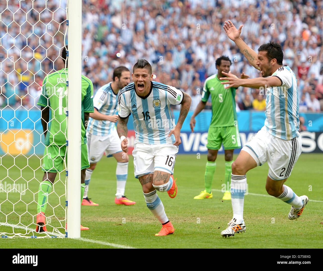 Argentina's Marcos Rojo (left) celebrates scoring his teams third goal of the game alongside teammate Ezequiel Garay Stock Photo