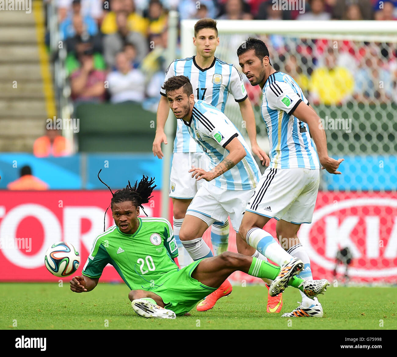 Nigeria's Michael Uchebo and Argentina's Ricky Alvarez (centre) battle for the ball Stock Photo