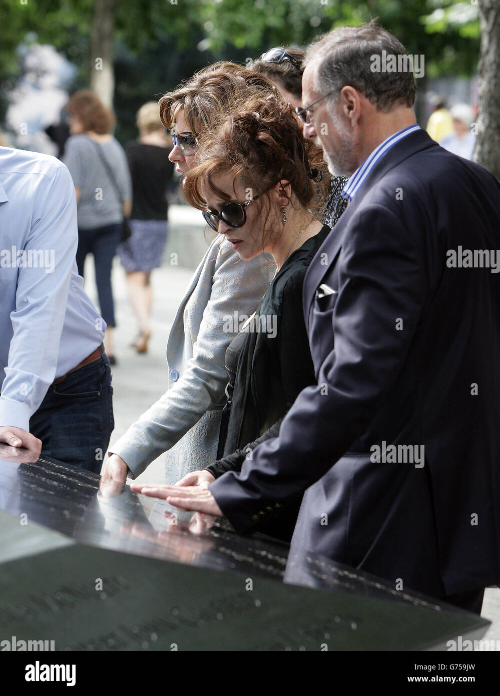 Members of the Prime Minister's Holocaust Commission (from left) Natasha Kaplinsky, Helena Bonham Carter and Mick Davis during a visit to the 9/11 memorial and Memorial Museum in New York, USA. Stock Photo