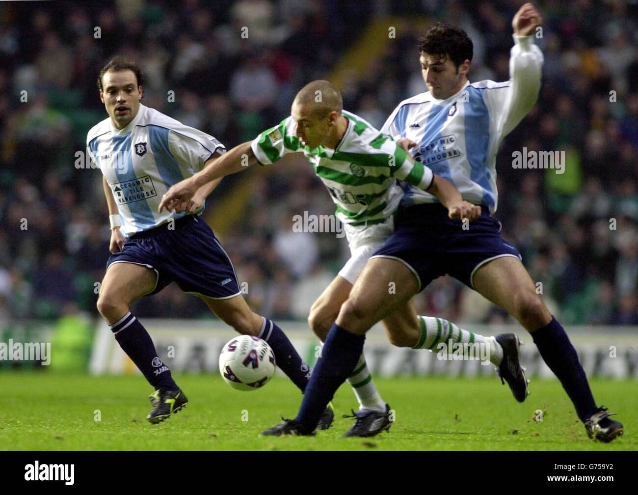 Scotland Gavin Rae Celtic's Henrik Larsson holds off Dundee's Zura Khizanishvili and Gavin ...
