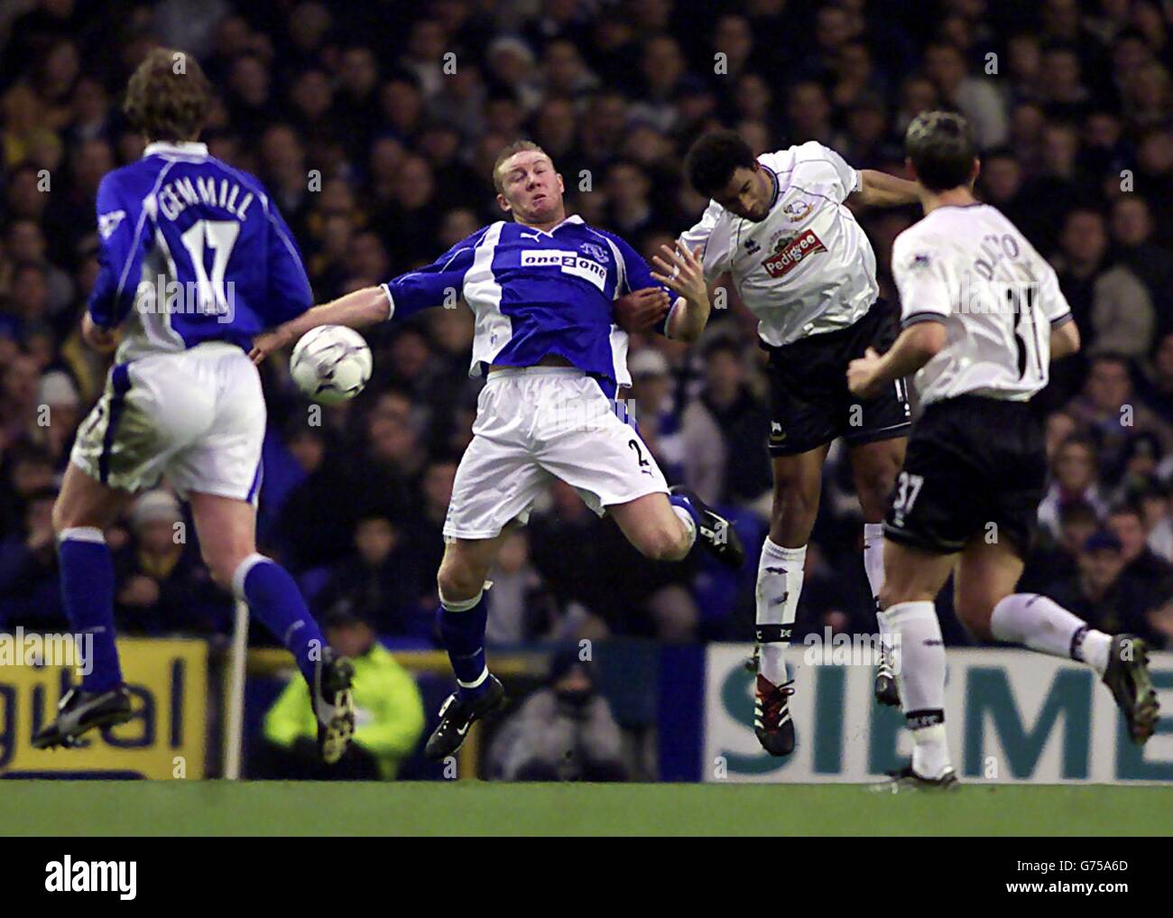 Derby County's Youl Mawene wins a header over Everton's Steve Watson (number 2), during their FA Barclaycard Premiership match at Everton's Goodison Park ground in Liverpool. Stock Photo