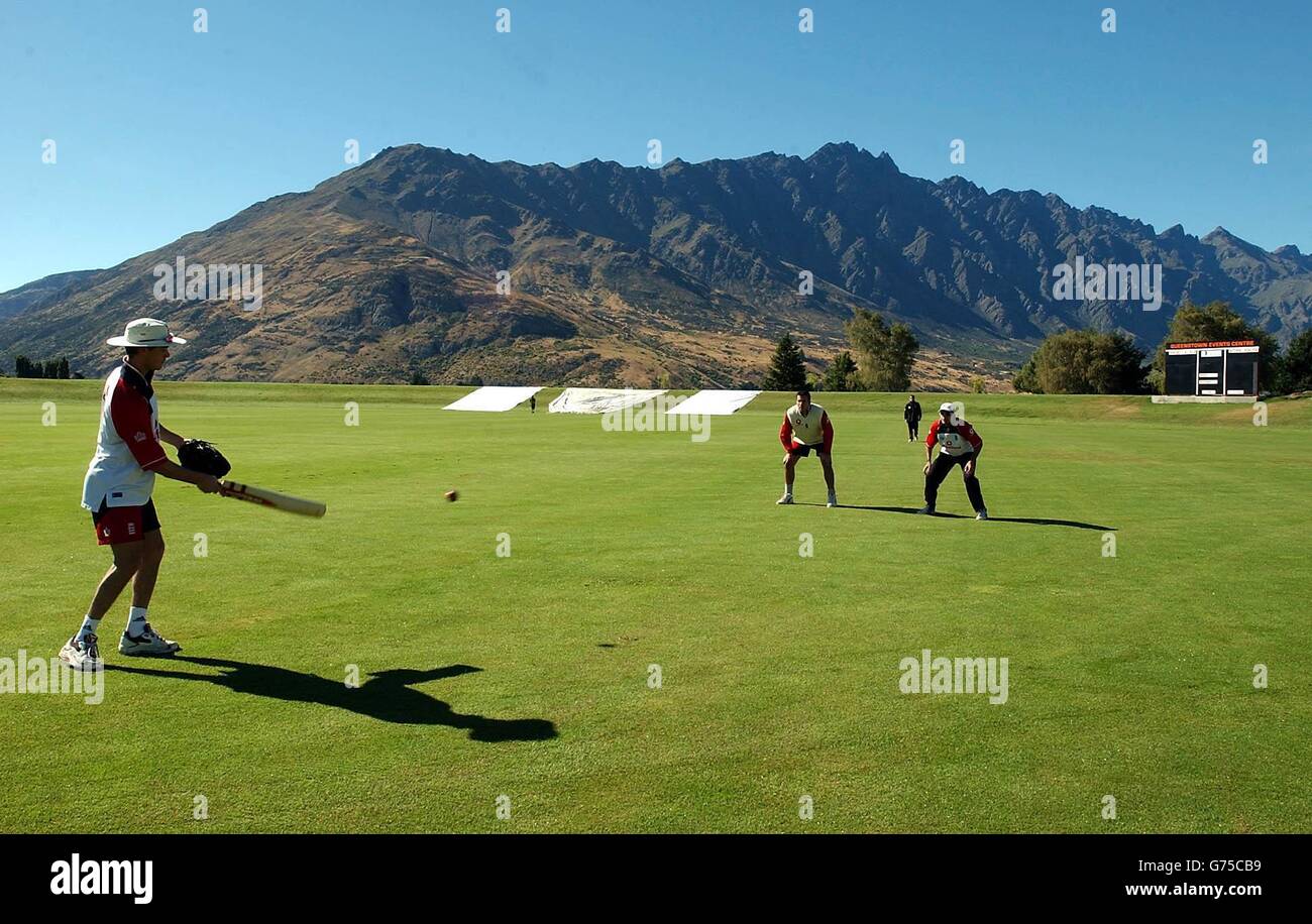 The Remarkables mountain range looms in the background as England's James Foster (left) takes part in the team net session at Davies Park, near Queenstown, New Zealand. England's match against Otago - the first three-day game of their tour of New Zealand - starts Saturday. Stock Photo