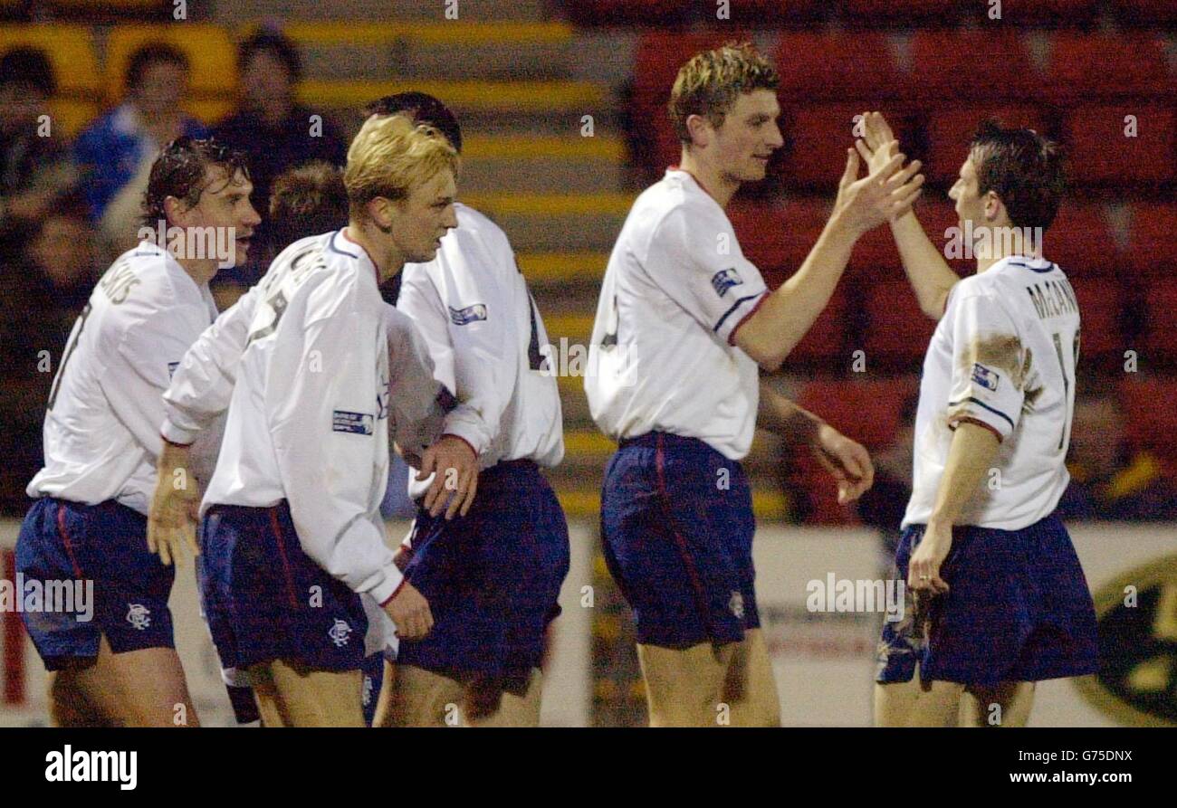 Rangers' Tore Andre Flo (2nd right) celebrates his goal against St Johnstone with teammate Neil McCann during the Bank of Scotland premiership match at McDiarmid Park in Perth. Stock Photo