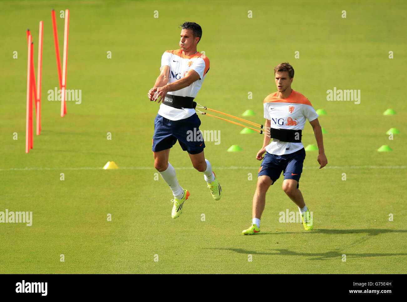 Netherlands' Robin van Persie and Joel Veltman (right) during the training session at Estadio Jose Bastos Padilha, Rio de Janeiro, Brazil. PRESS ASSOCIATION Photo. Picture date: Wednesday July 2, 2014. Photo credit should read: Mike Egerton/PA Wire. RESTRICTIONS: Editorial use only. No commercial use. No use with any unofficial 3rd party logos. No manipulation of images. No video emulation Stock Photo