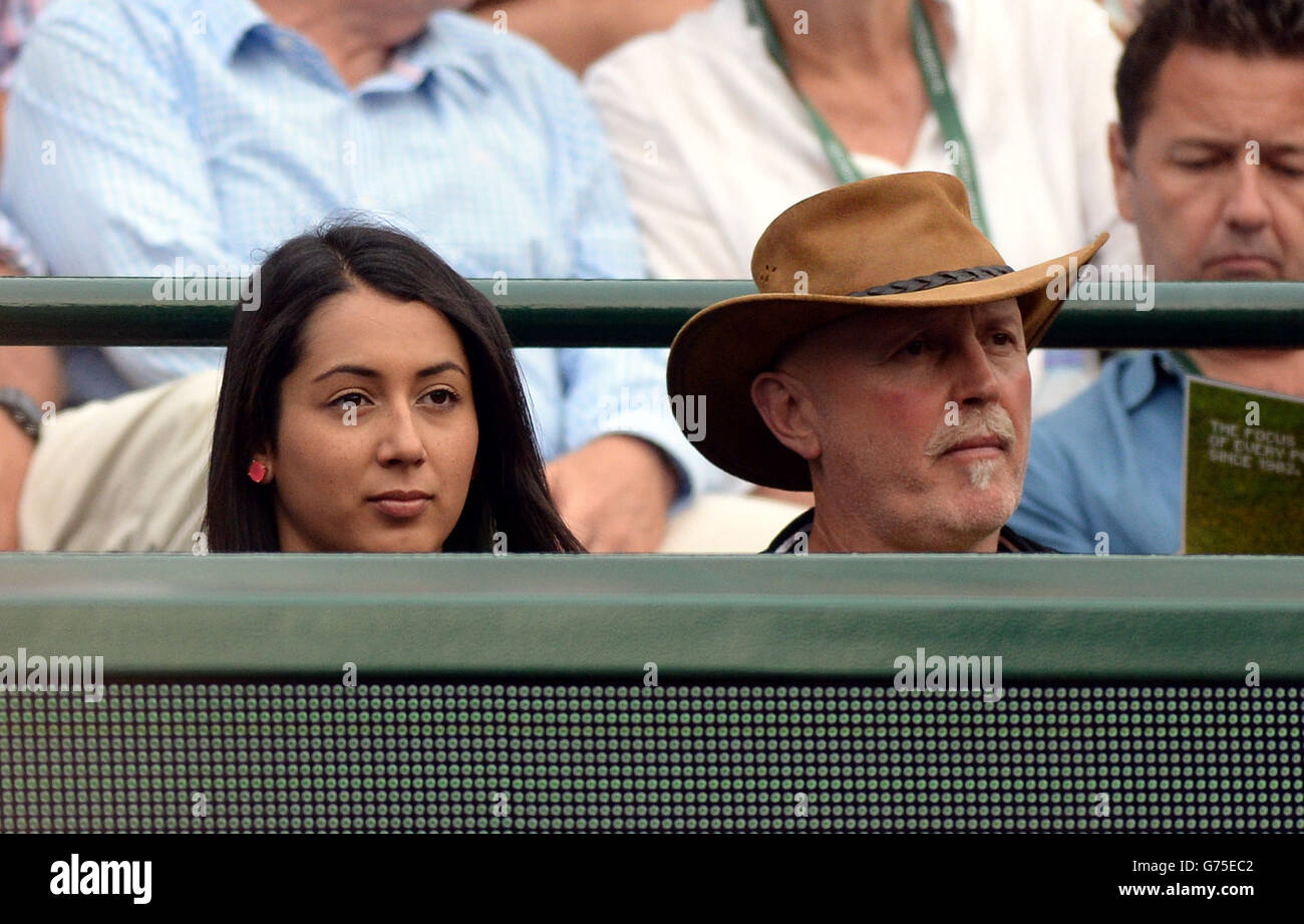 Australia's Nick Kyrgios' father and sister, George and Halimah watch his match against Canada's Milos Raonic during day ten of the Wimbledon Championships at the All England Lawn Tennis and Croquet Club, Wimbledon. Stock Photo