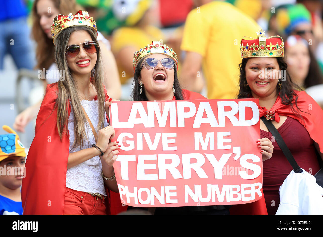Fans with a comical sign in the stands before the FIFA World Cup, Group D match at the Estadio Mineirao, Belo Horizonte, Brazil. Stock Photo