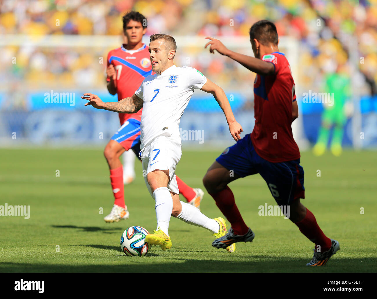 England's Jack Wilshere gets away from Costa Rica's Cristian Gamboa (right) as they battle for the ball during the FIFA World Cup, Group D match at the Estadio Mineirao, Belo Horizonte, Brazil. Stock Photo