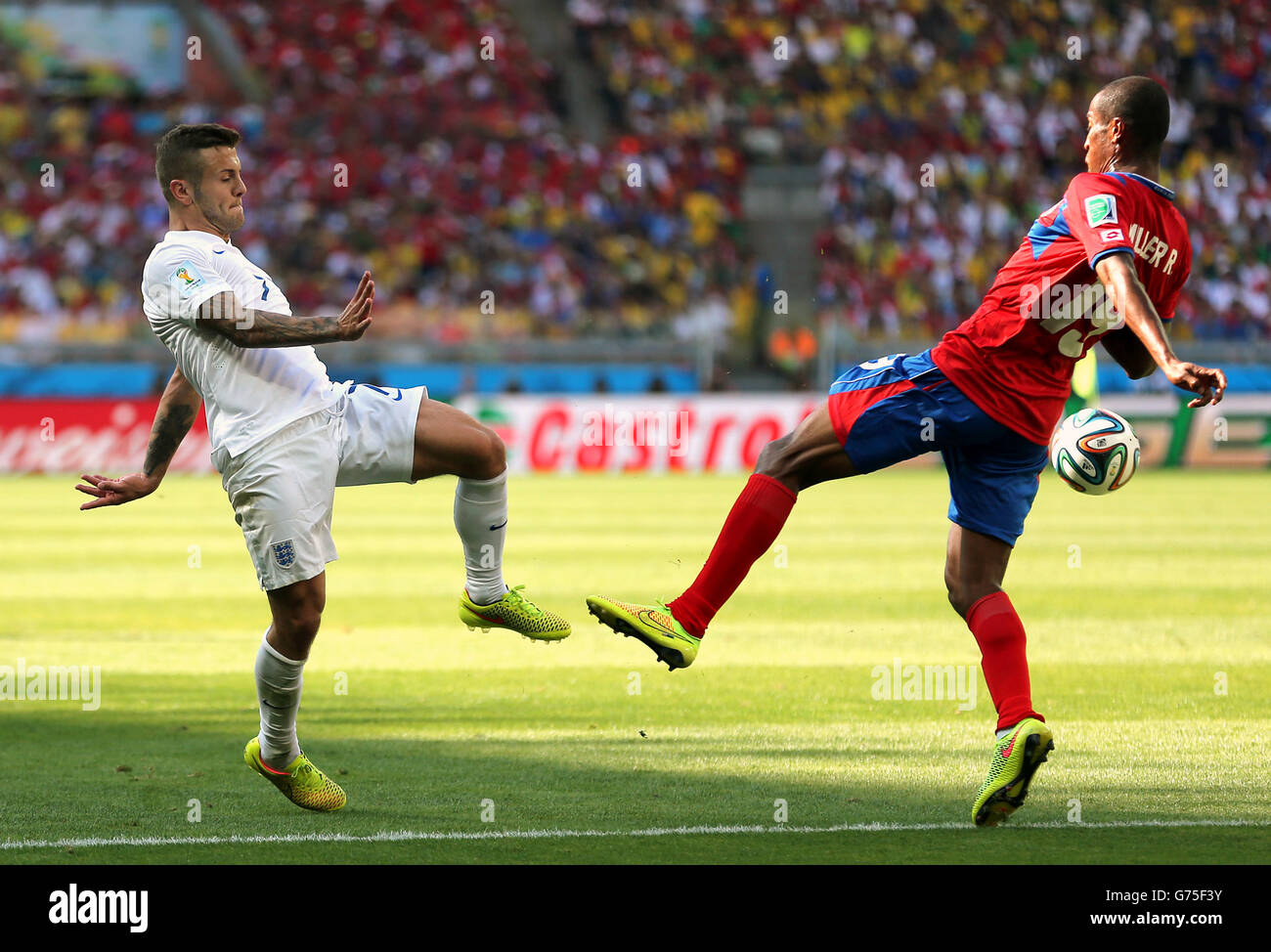 England's Jack Wilshere (left) and Costa Rica's Roy Miller battle for the ballduring the FIFA World Cup, Group D match at the Estadio Mineirao, Belo Horizonte, Brazil. Stock Photo