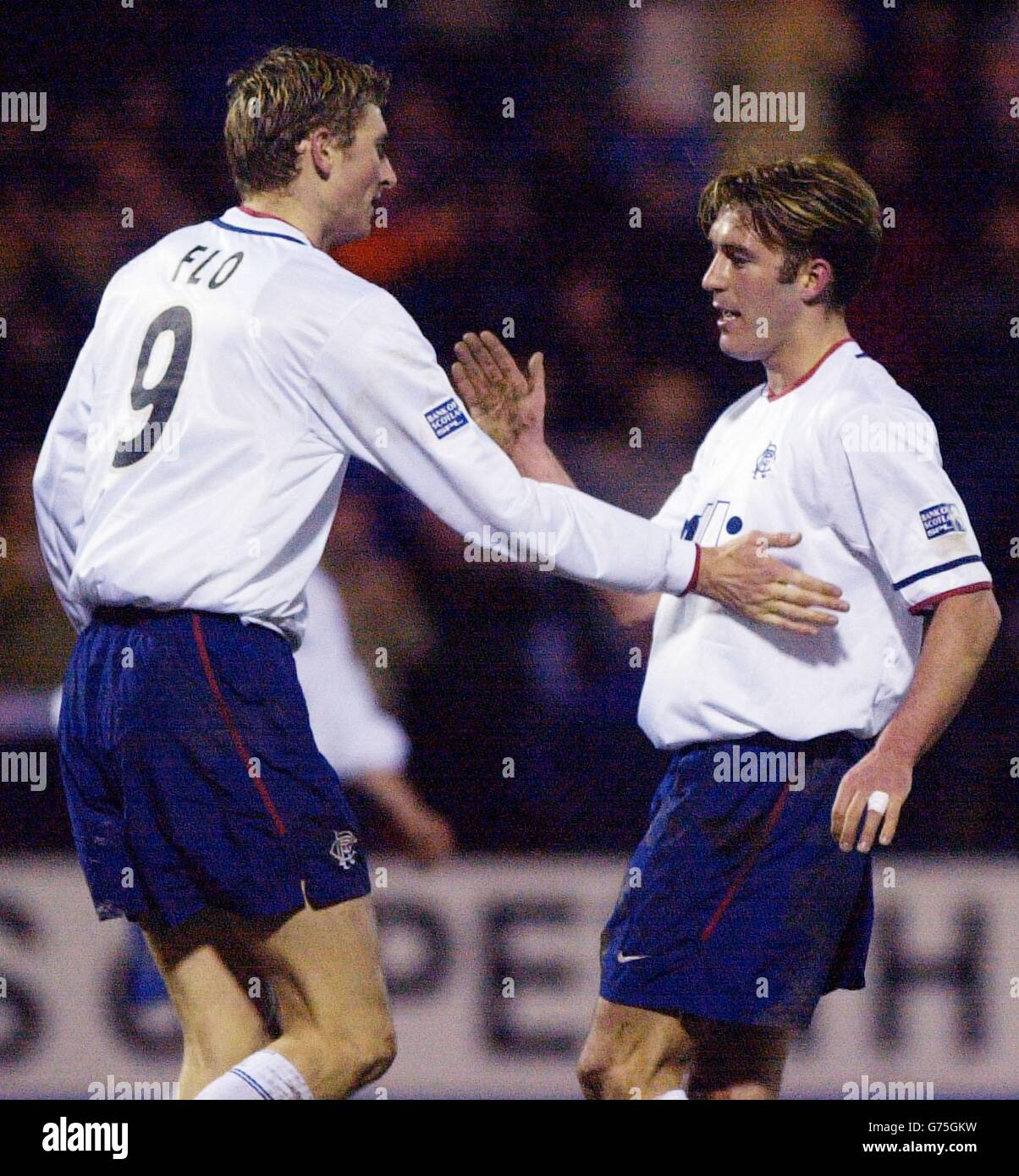 Rangers' Fernando Ricksen (right) celebrates his goal against St Johnstone with fellow goalscorer Tore Andre Flo during the Bank of Scotland premiership match at McDiarmid Park in Perth. Stock Photo