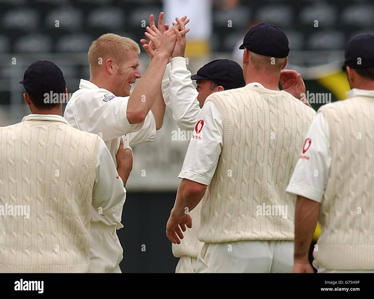 England's Matthew Hoggard (second left) and Graham Thorpe celebrate after Hoggard took the wicket of New Zealand's Matthew Horne who was caught by Thorpe for 14 runs during the second day of the first test match against New Zealand at Jade Stadium, Christchurch. Stock Photo