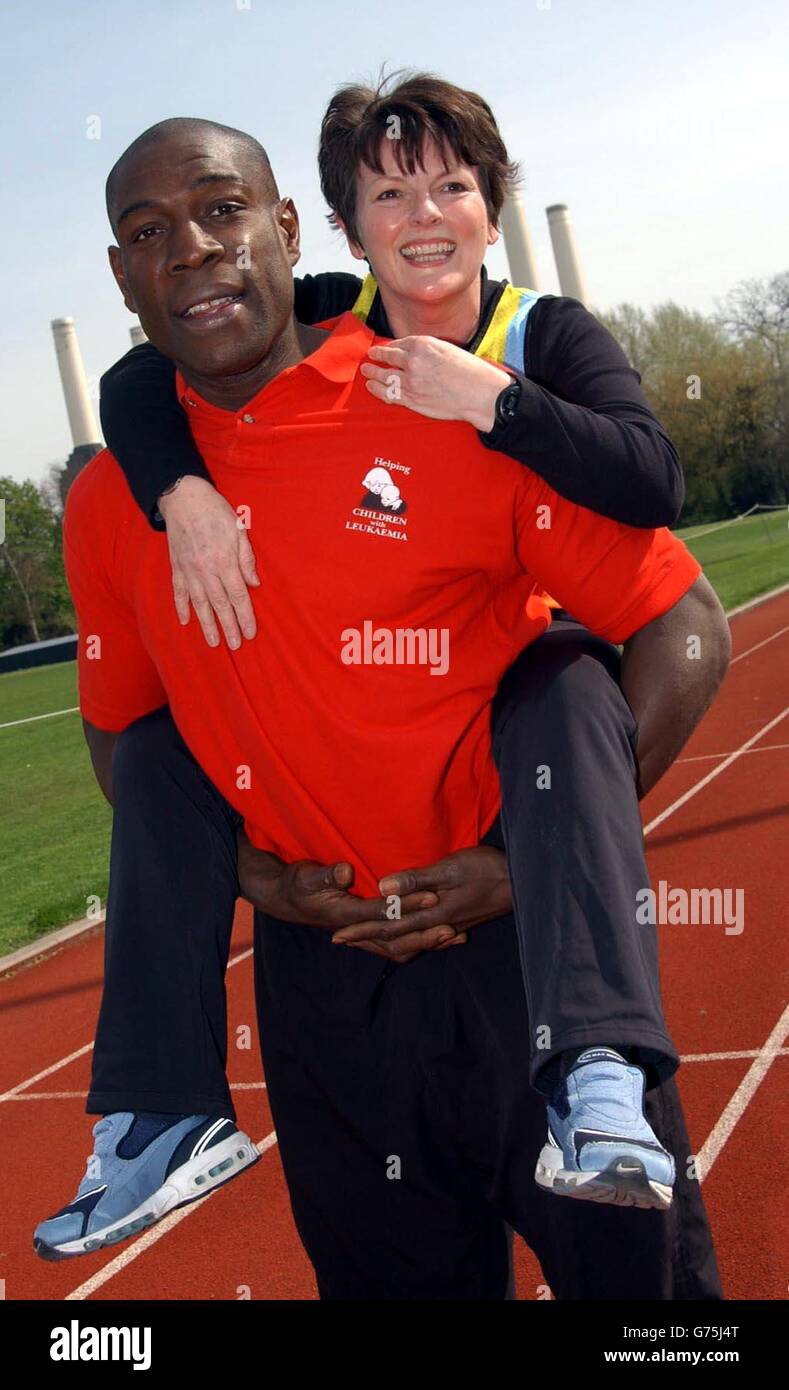 Former boxer Frank Bruno gives actress Brenda Blethyn a piggy back during a photocall to launch the 'Children with Leukaemia' official 2002 Flora London Marathon charity team at the Millennium Arena, Battersea Park. Stock Photo