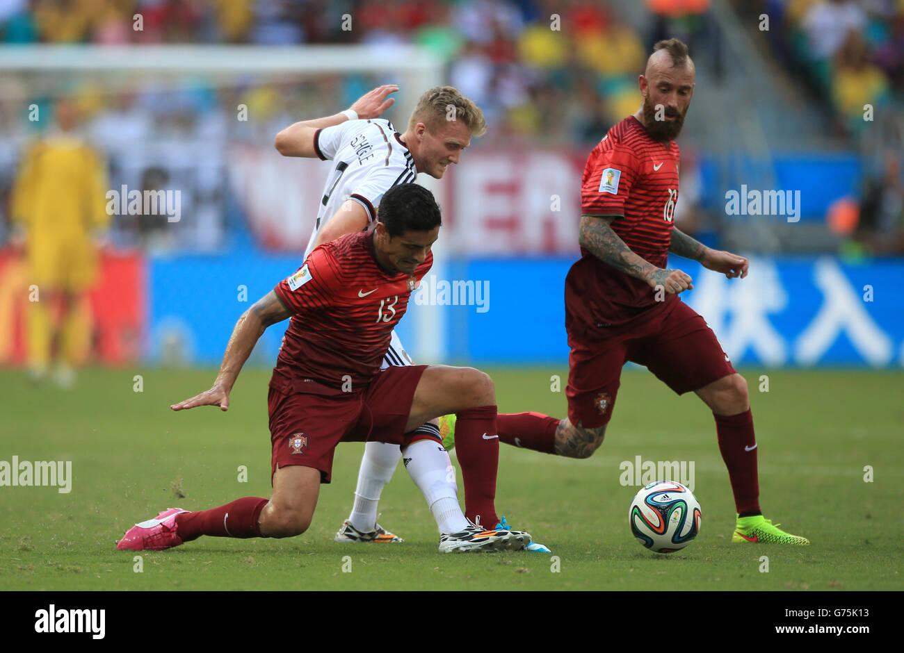 Portugal's Ricardo Costa (bottom) and Germany's Andre Schurrle battle for the ball Stock Photo