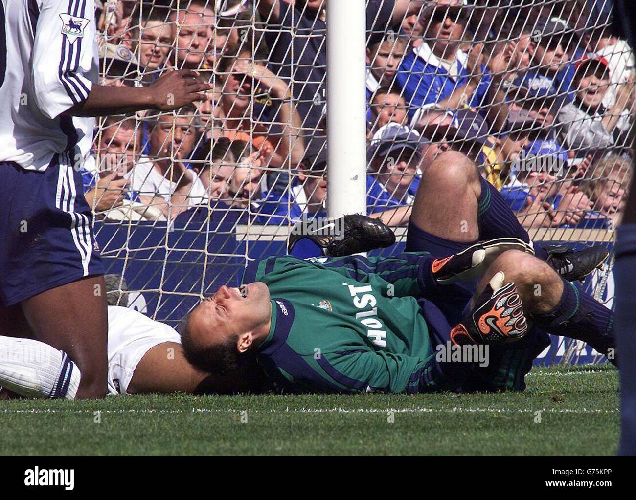 Spurs GK Kasey Keller is felled inside the goalmouth during the FA Barclaycard Premiership game against Leicester at Filbert Street, Leicester. Stock Photo