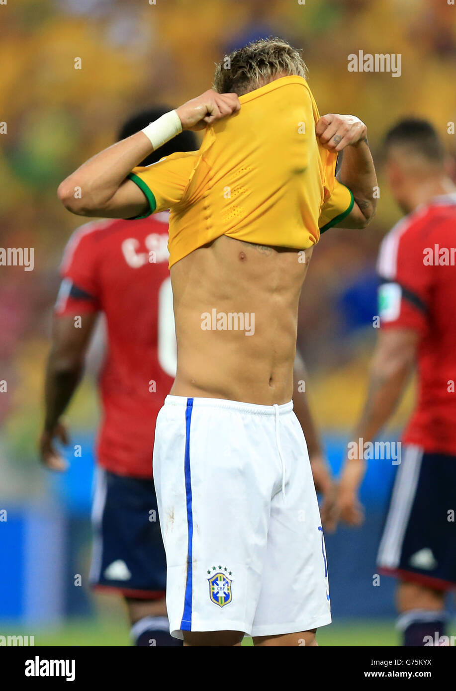 Brazil's Neymar pulls his shirt over his face after a missed chance during the quarter final match at the Estadio Castelao, Fortaleza. Stock Photo