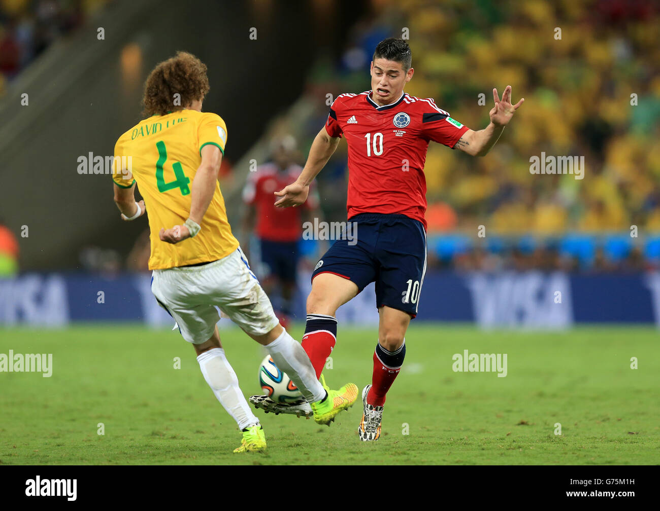 Colombia's James Rodriguez (right) and Brazil's David Luiz (left) battle for the ball during the quarter final match at the Estadio Castelao, Fortaleza. Stock Photo