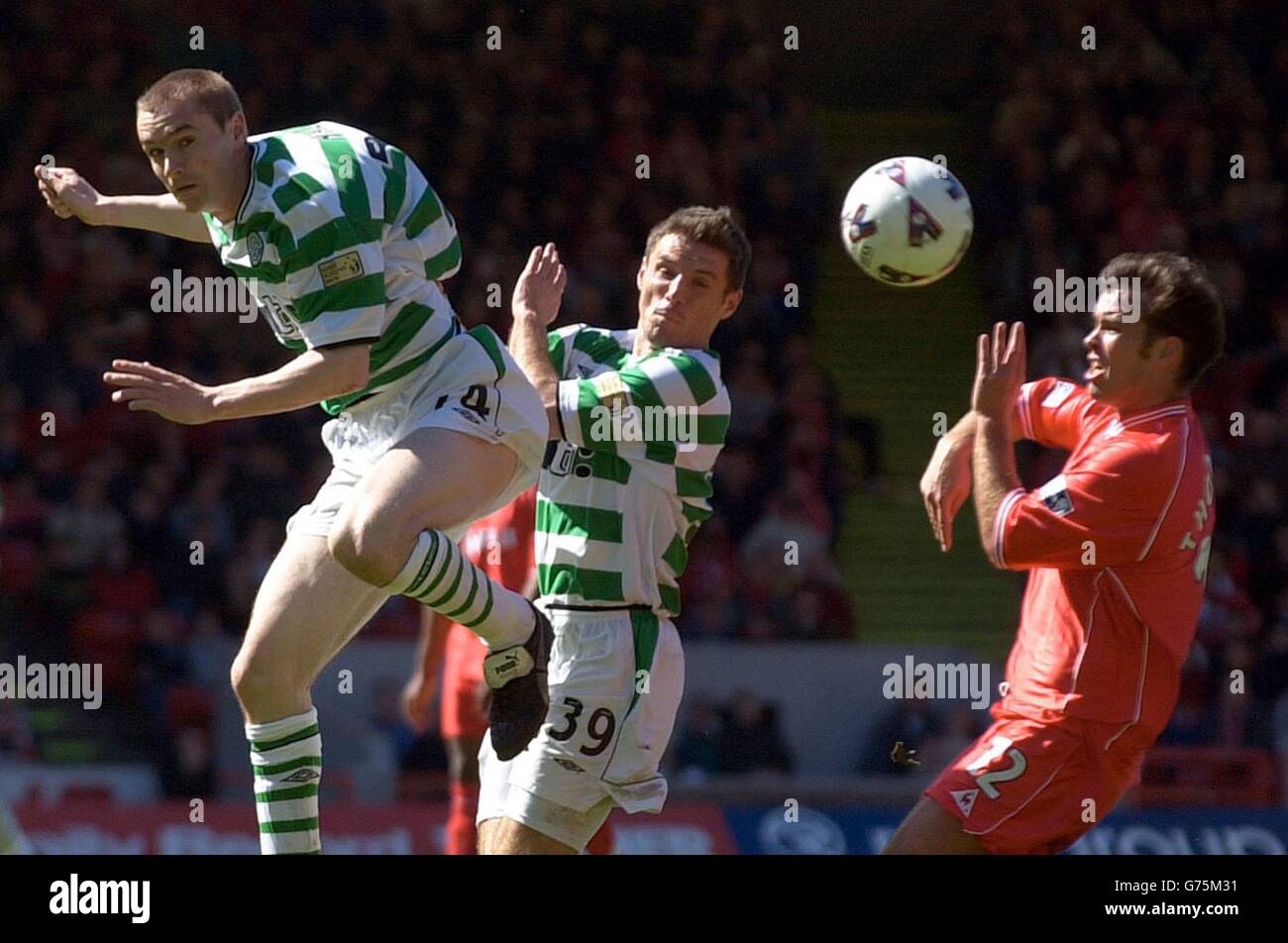 Celtic's Colin Healy (left) heads the ball past teammate Jamie Smith during the match in the Bank of Scotland Scottish Premier League at Aberdeen's Pittodrie stadium. Stock Photo