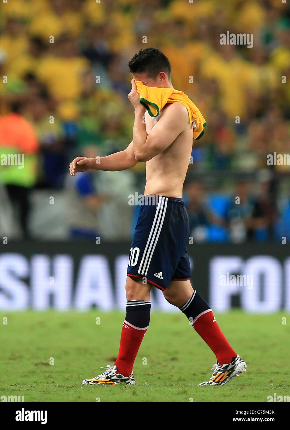 Colombia's James Rodriguez shows his emotion as he walks off the pitch after the quarter final match at the Estadio Castelao, Fortaleza. Stock Photo