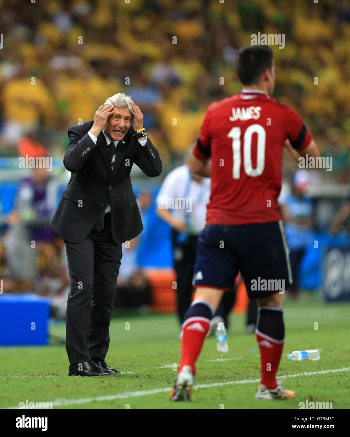 Colombia manager Jose Pekerman gestures towards Colombia's James Rodriguez (right) during the quarter final match at the Estadio Castelao, Fortaleza. Stock Photo