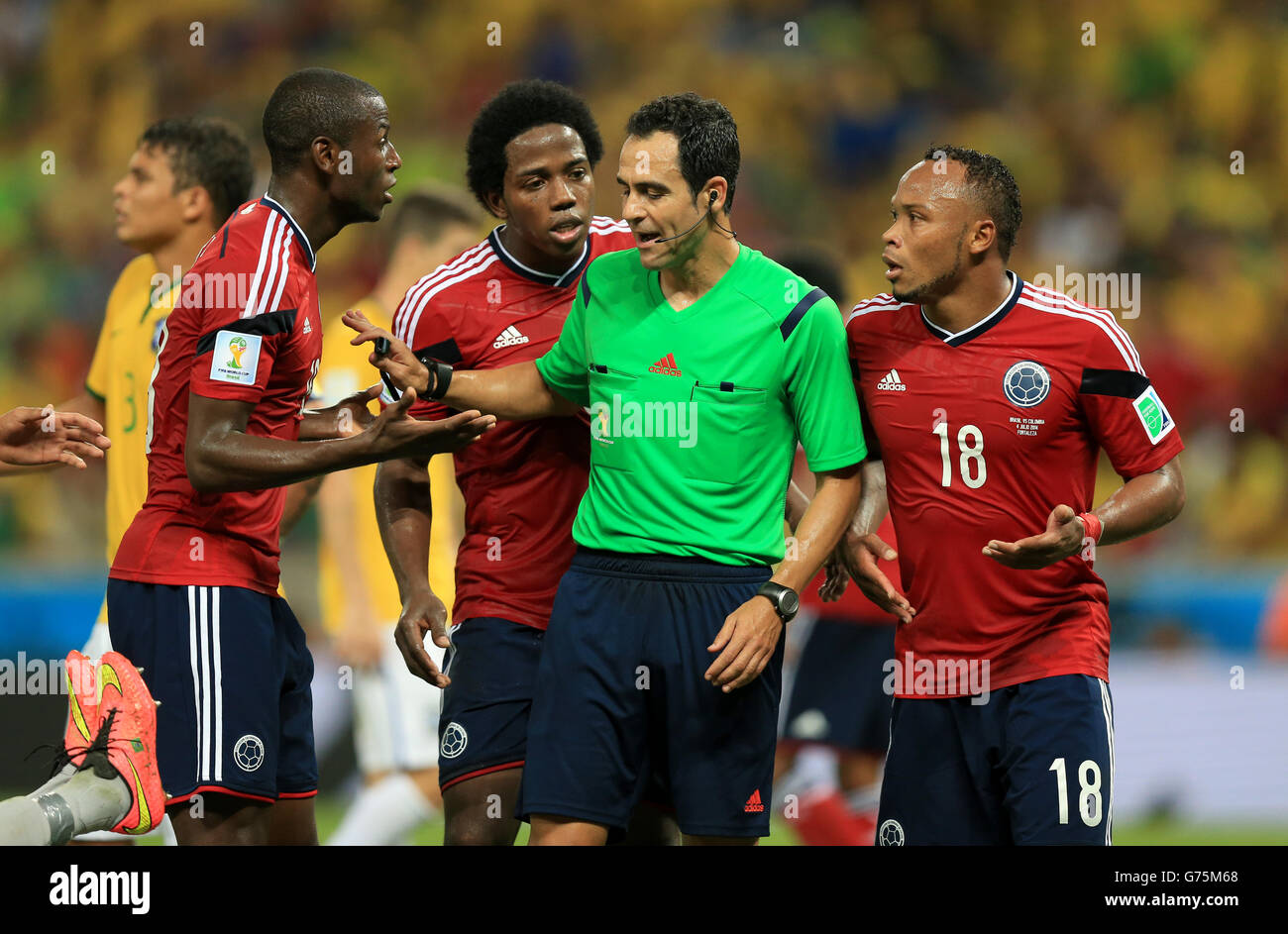 Colombia's Fredy Guarin (left) and Colombia's Juan Camilo Zuniga (right) argue with the referee during the quarter final match at the Estadio Castelao, Fortaleza. Stock Photo