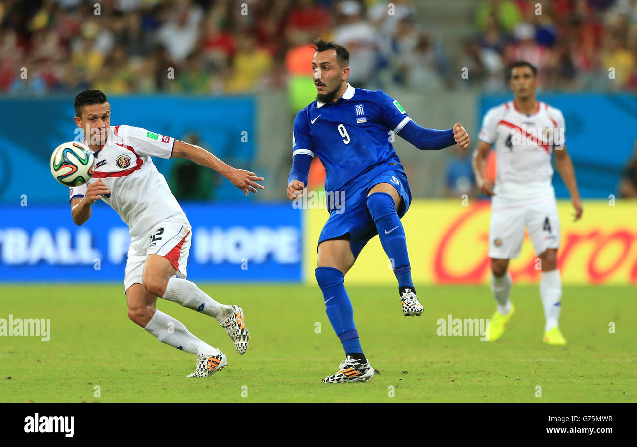 Soccer - FIFA World Cup 2014 - Round of 16 - Costa Rica v Greece - Arena Pernambuco. Greece's Kostas Mitroglou and Costa Rica's Jose Cubero (left) in action Stock Photo