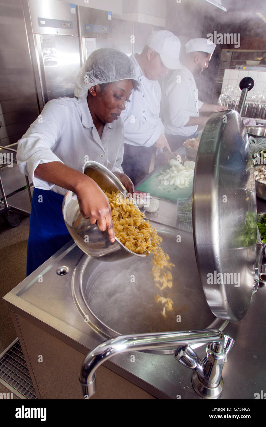 Preparations for lunch in a commercial kitchen. Stock Photo