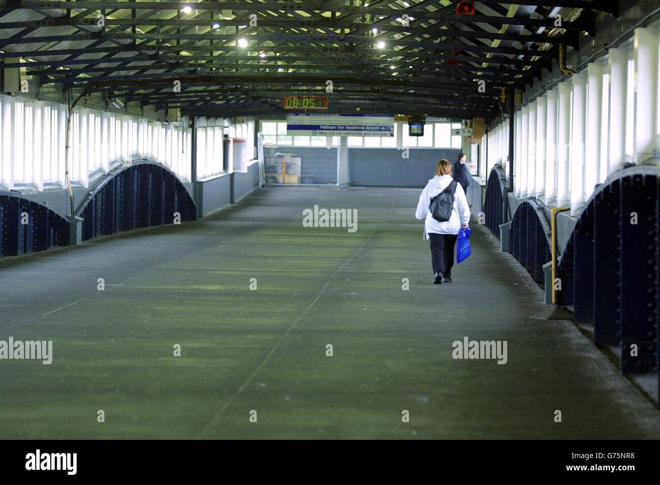 The walkway connecting platforms at Clapham Junction in south London - dubbed Britain's busiest railway station, with some 2,000 trains a day - is almost deserted in the rush hour as England play Nigeria in the World Cup. Stock Photo