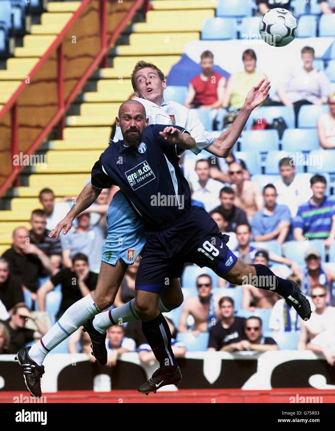 Aston Villa's Peter Crouch leaps above FC Zurich's Yvan Quentin during the Intertoto Cup, third round, second leg game between Aston Villa and FC Zurich at Villa Park, Birmingham. Stock Photo