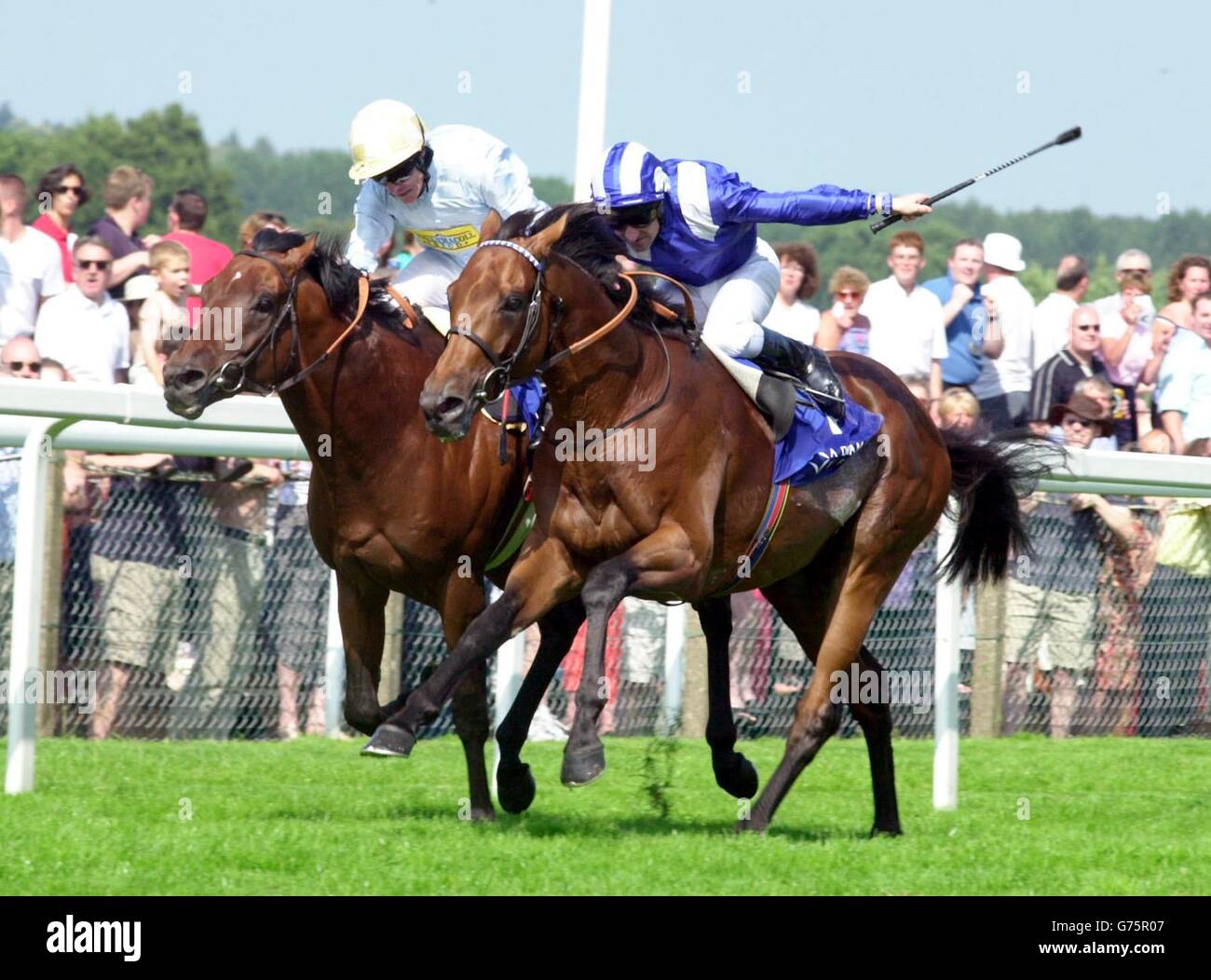 Golan, ridden Kieren Fallon up (left) beats Nayef ridden by Richard Hills to win The King George V1 and Queen Elizabeth Diamond Stakes at Ascot. Stock Photo
