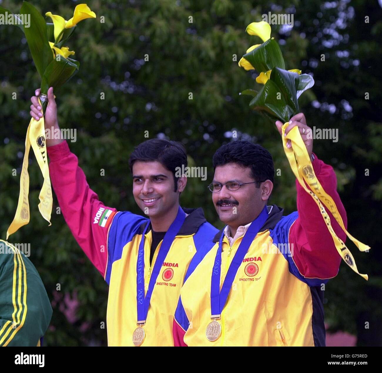 India's Vivek Singh (left) and Samaresh Jung celebrate gold in the Men's 50 metre Pistol Pairs. The pair posed during the medal ceremony after the shooting competition at the National Shooting Centre, Bisley. Stock Photo
