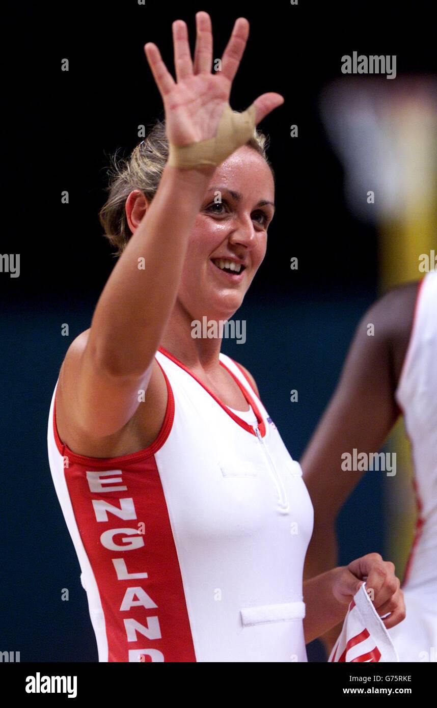 Sport netball footballers sister waving smiling hires stock