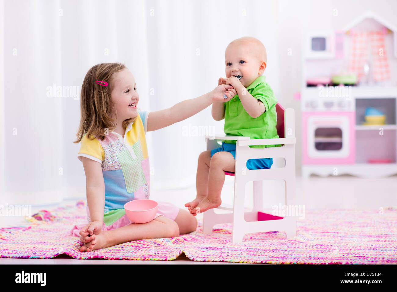 little girls playing with babies
