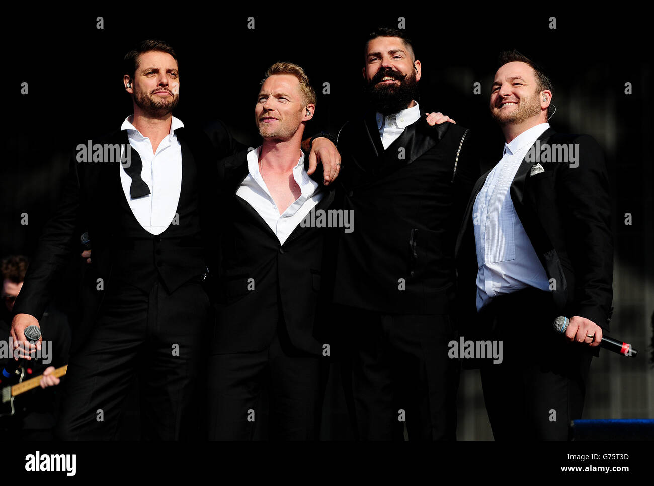 Boyzone (from left to right) Keith Duffy, Ronan Keating, Shane Lynch and Mikey Graham performing at the Barclaycard British Summer Time Festival in Hyde Park, London. Stock Photo