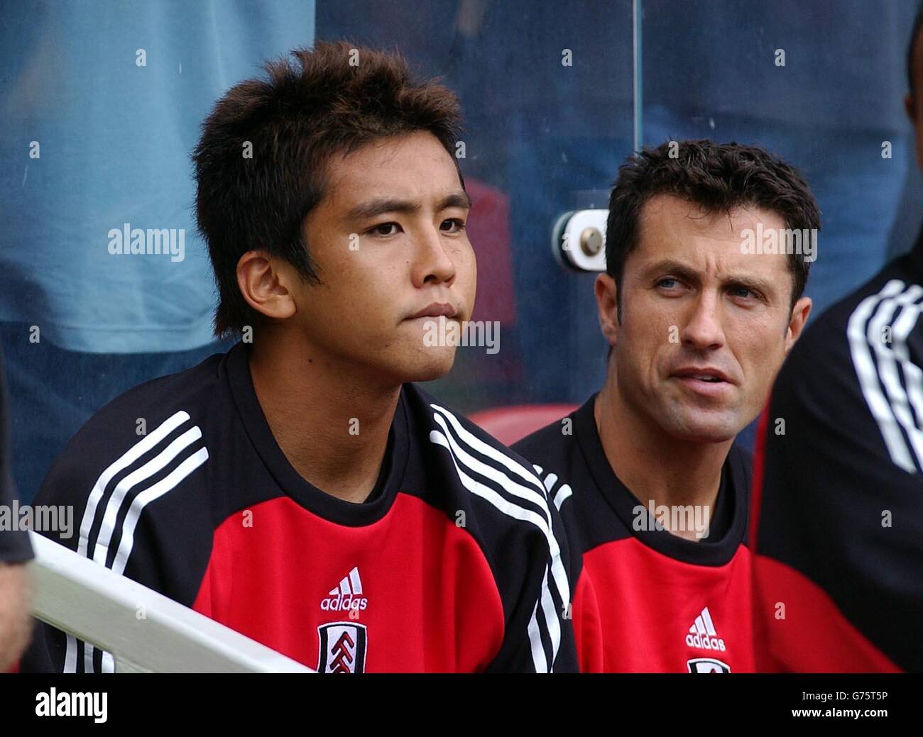 Fulham's Japanese star Junichi Inamoto sits the bench before coming on against Middlesbrough during their FA Barclaycard Premiership match at Middlesbrough's Riverside Stadium. Final score: Middlesbrough 2 Fulham 2. Stock Photo