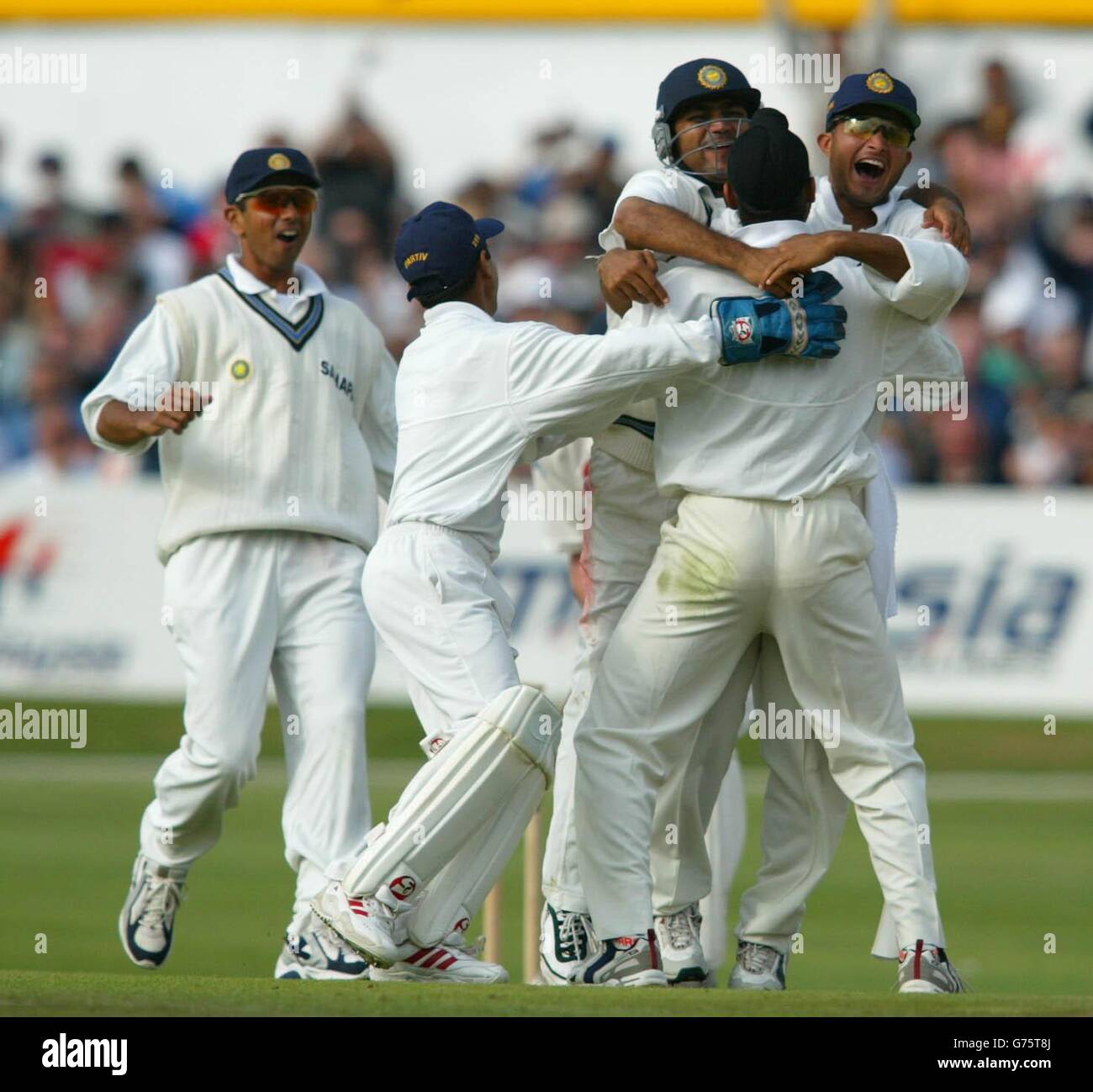 Indian fielders run to congratulate Harbajahn Singh (centre) after he dismissed Andrew Flintoff for Zero during the third day of the third nPower test match between England and India at Headingley in Leeds. Stock Photo