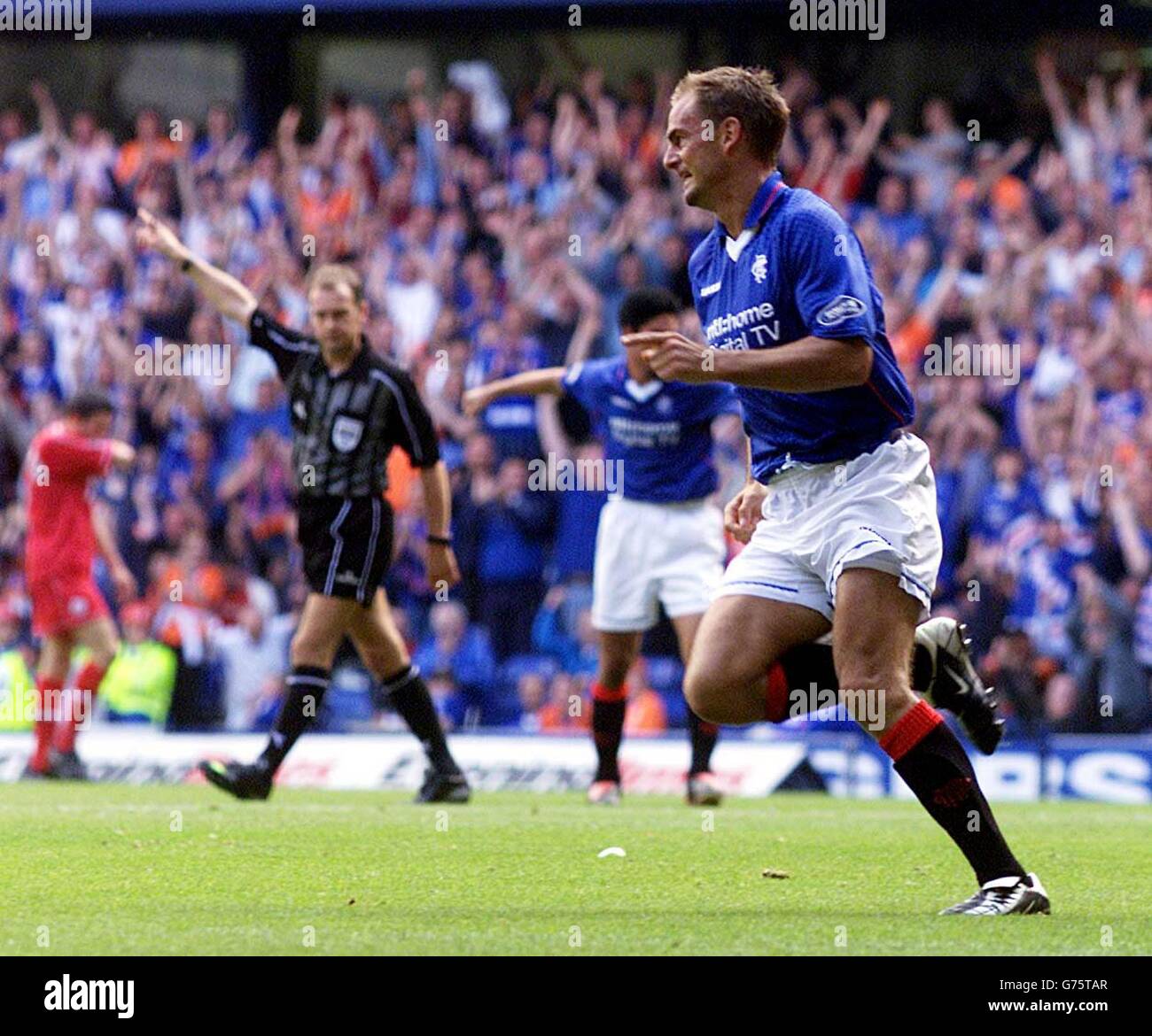 Ronald de Boer celebrates scoring against Aberdeen during their Bank of Scotland Premier League match at Rangers' Ibrox Stadium in Glasgow. Stock Photo