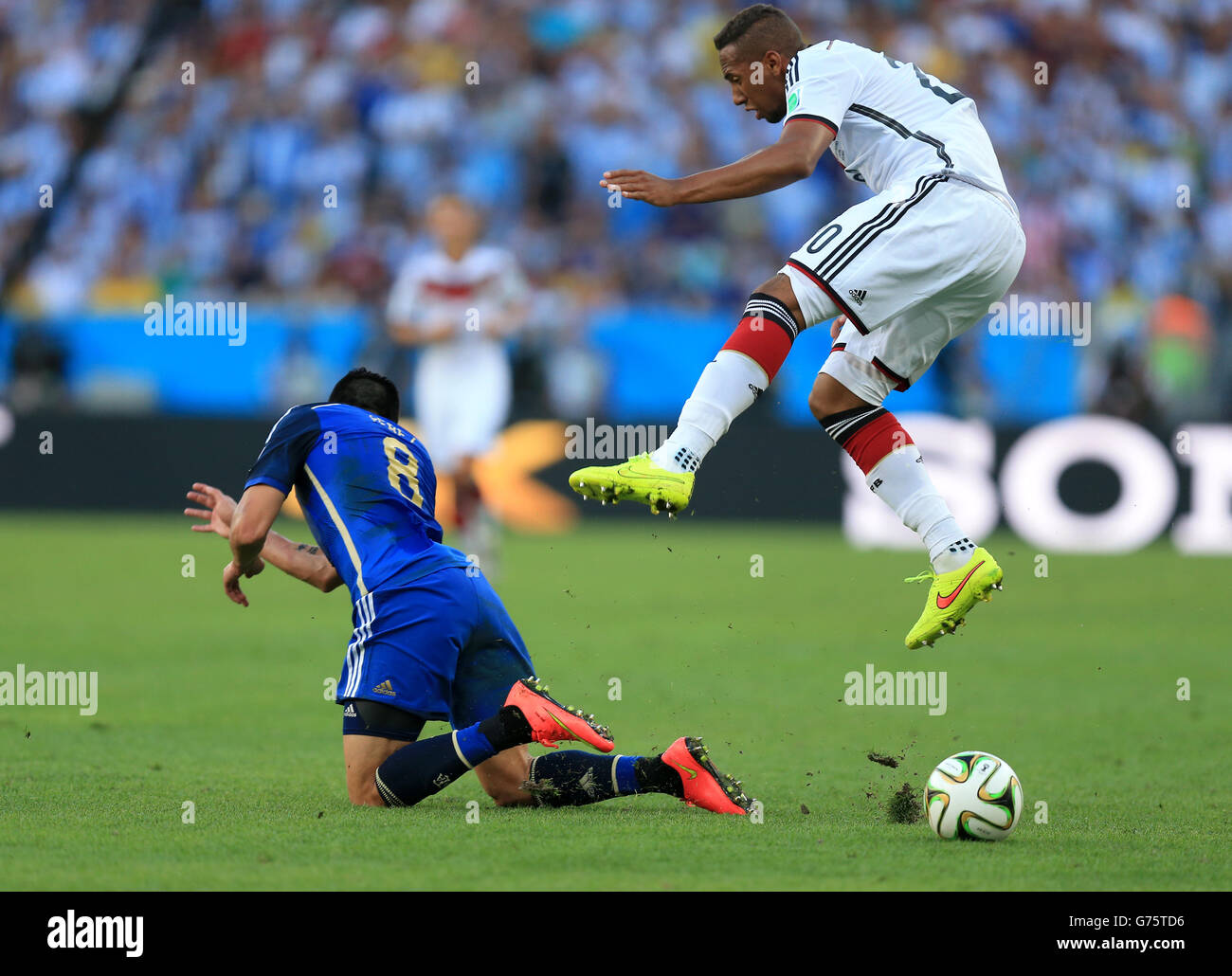 Argentina's Enzo Perez battles for the ball with Germany's Jerome Boateng during the FIFA World Cup Final at the Estadio do Maracana, Rio de Janerio, Brazil. Stock Photo